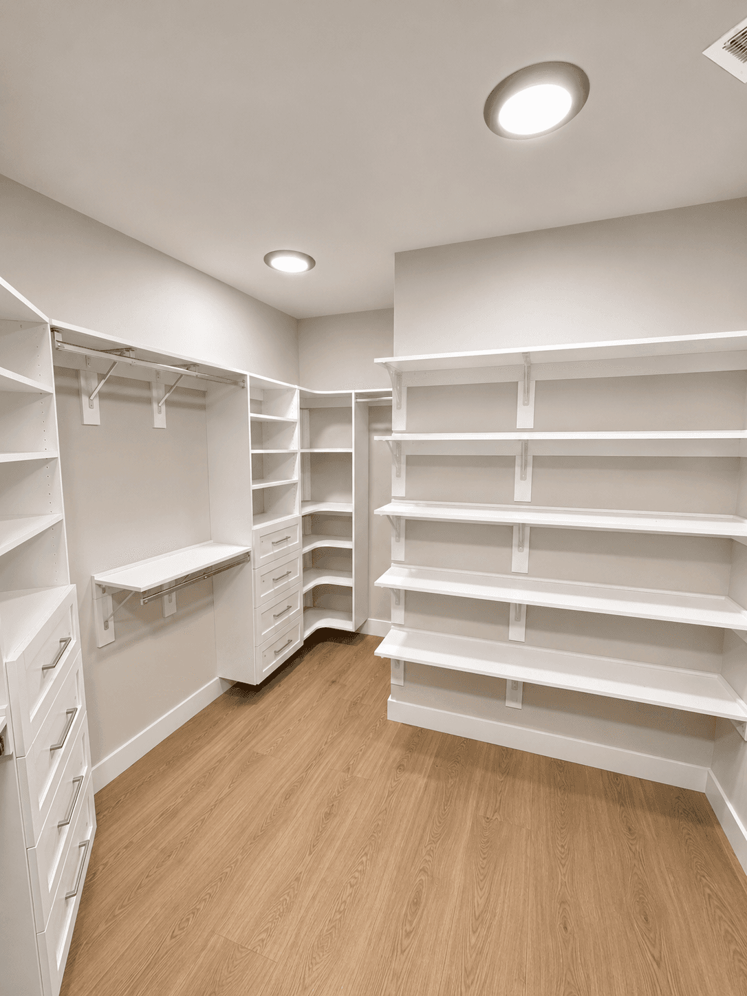 Custom closet installation with built-in organization and finished storage.