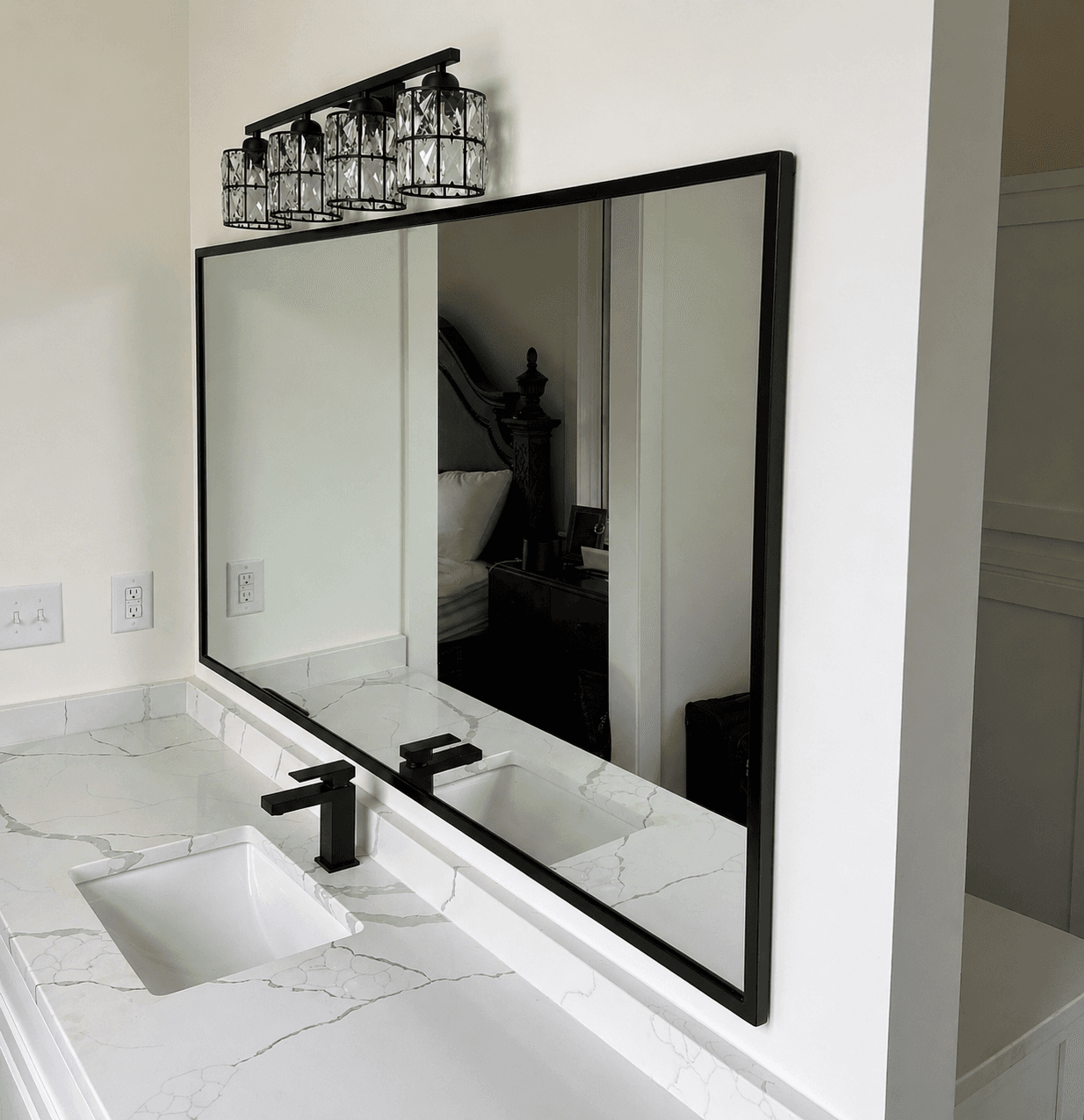 Custom glass mirror—reflective wall panel with polished edges and interior context.