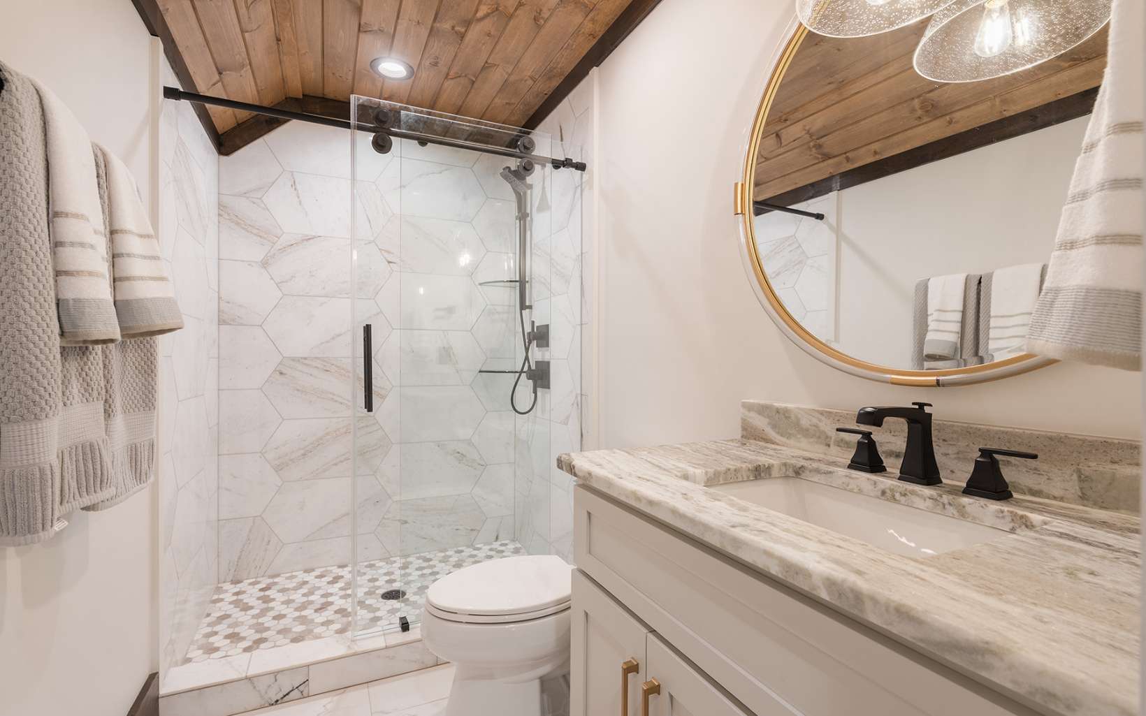 Large custom mirror wall reflecting interior light.