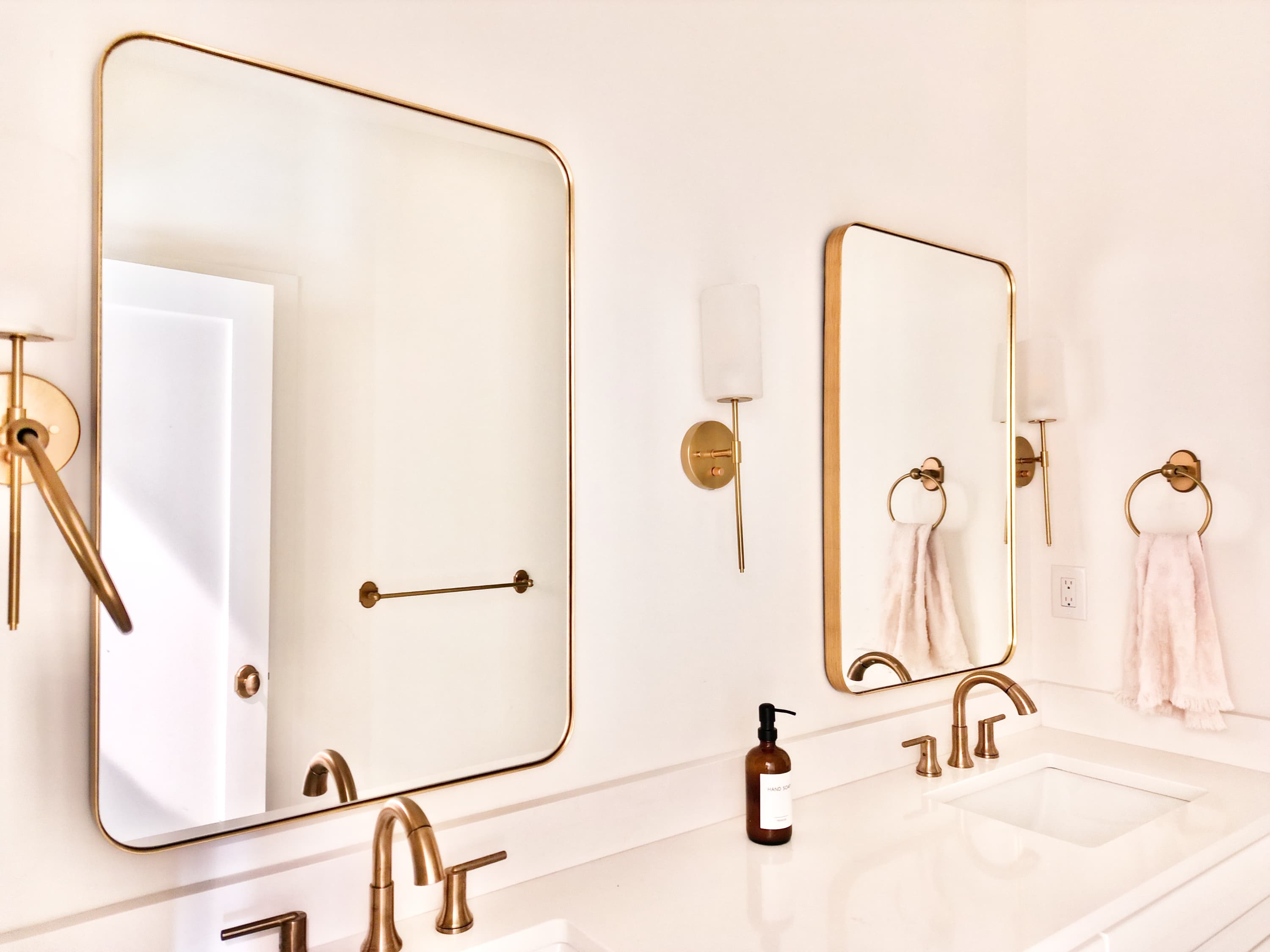 Custom mirror installation—large reflective wall glass with clean edges and interior detail.