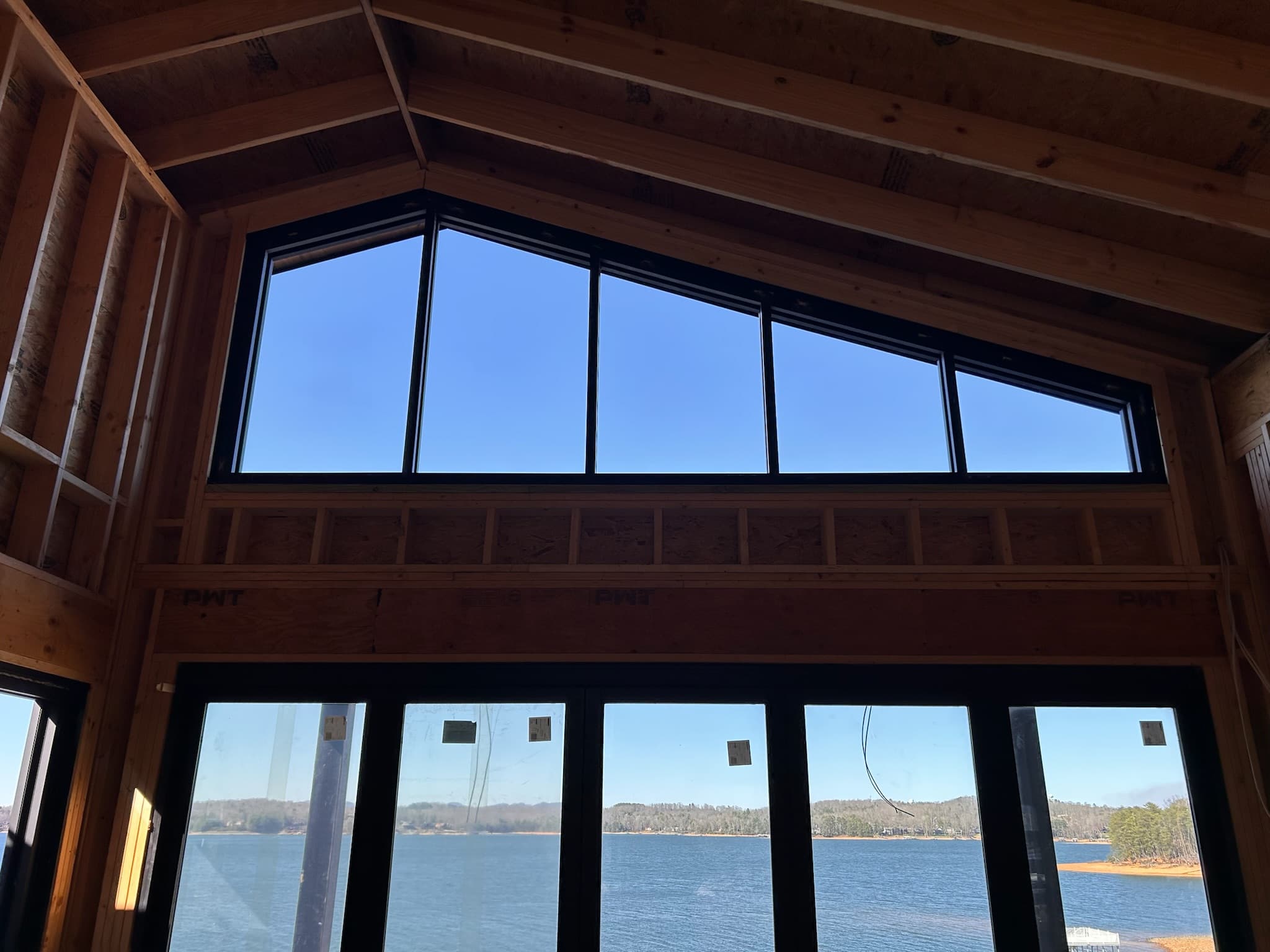 Residential windows and insulated glass—clear glazing on a home exterior.