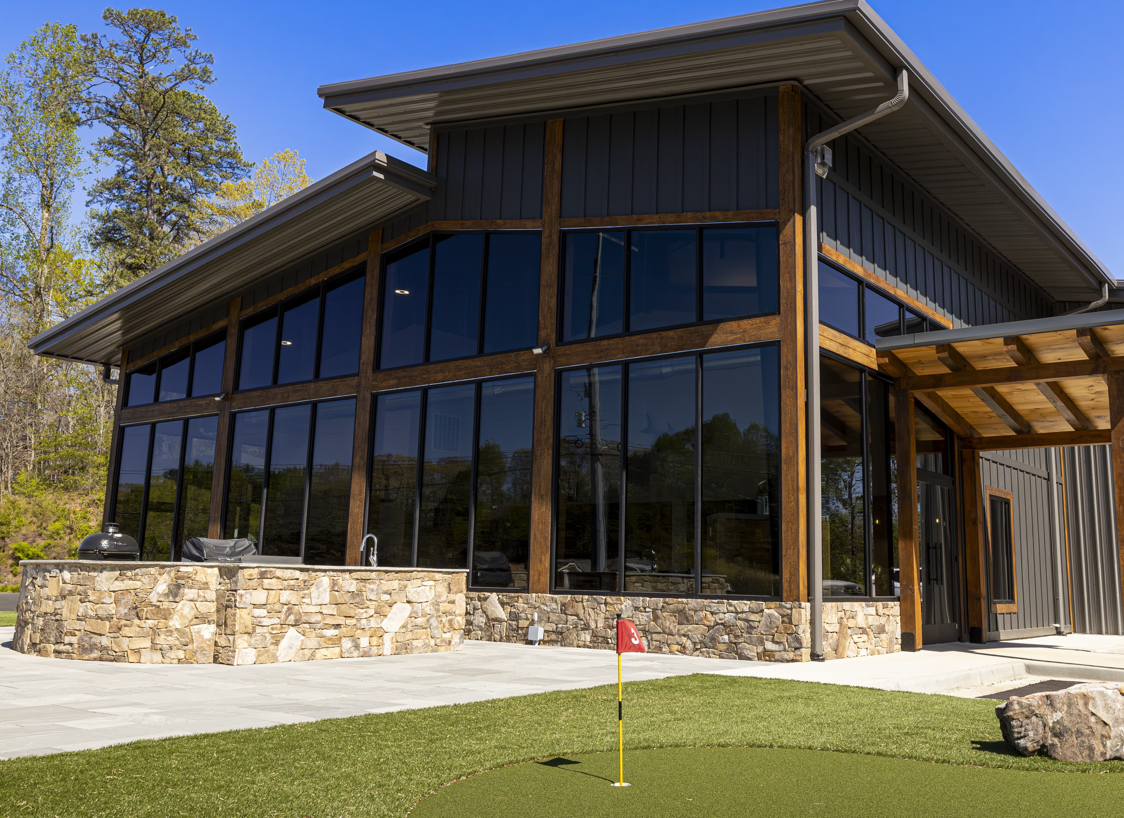 Residential exterior and porch detail—metal and glass on a mountain home.