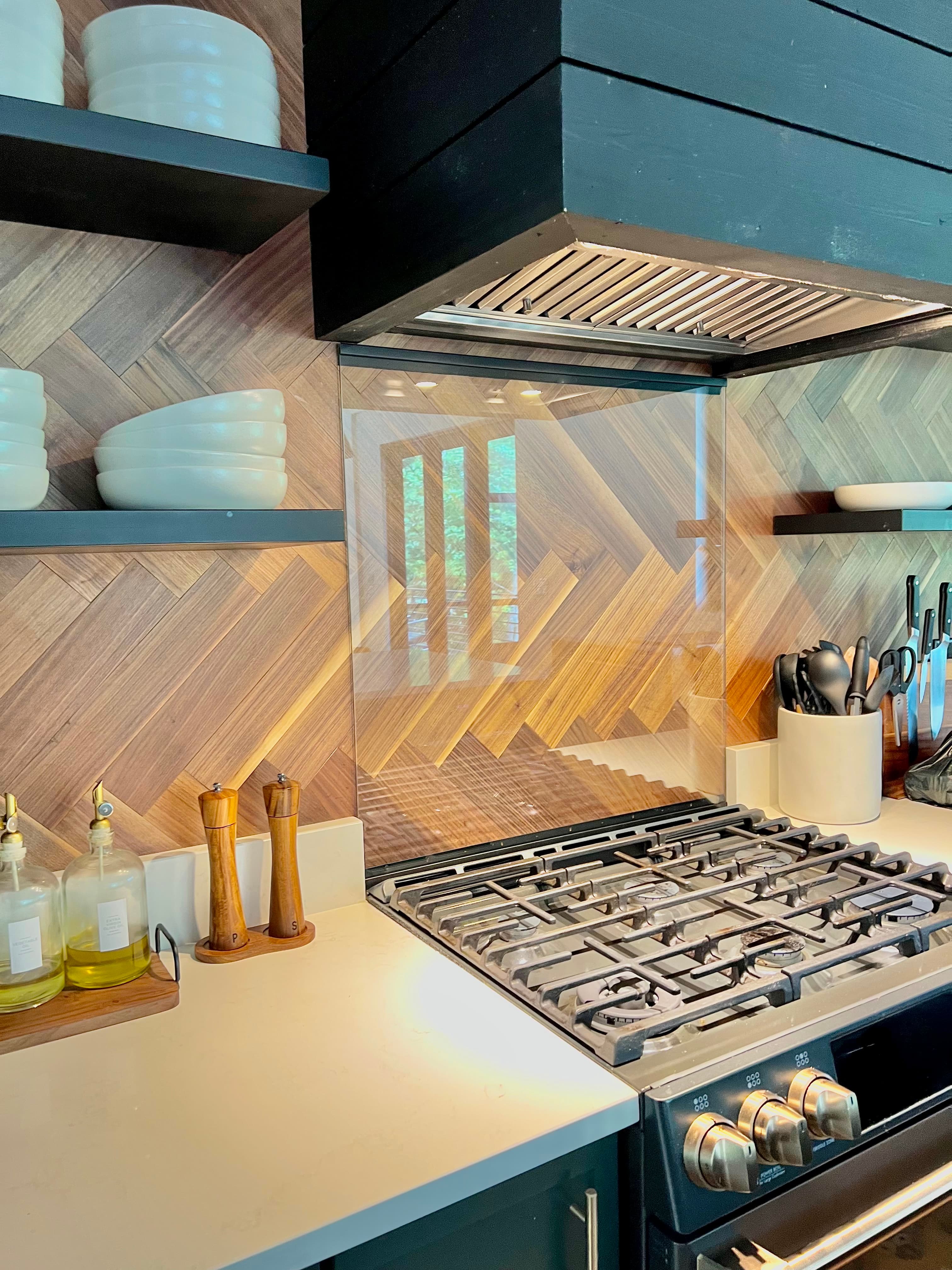 Tempered glass panel for a kitchen stove or cooktop surround.
