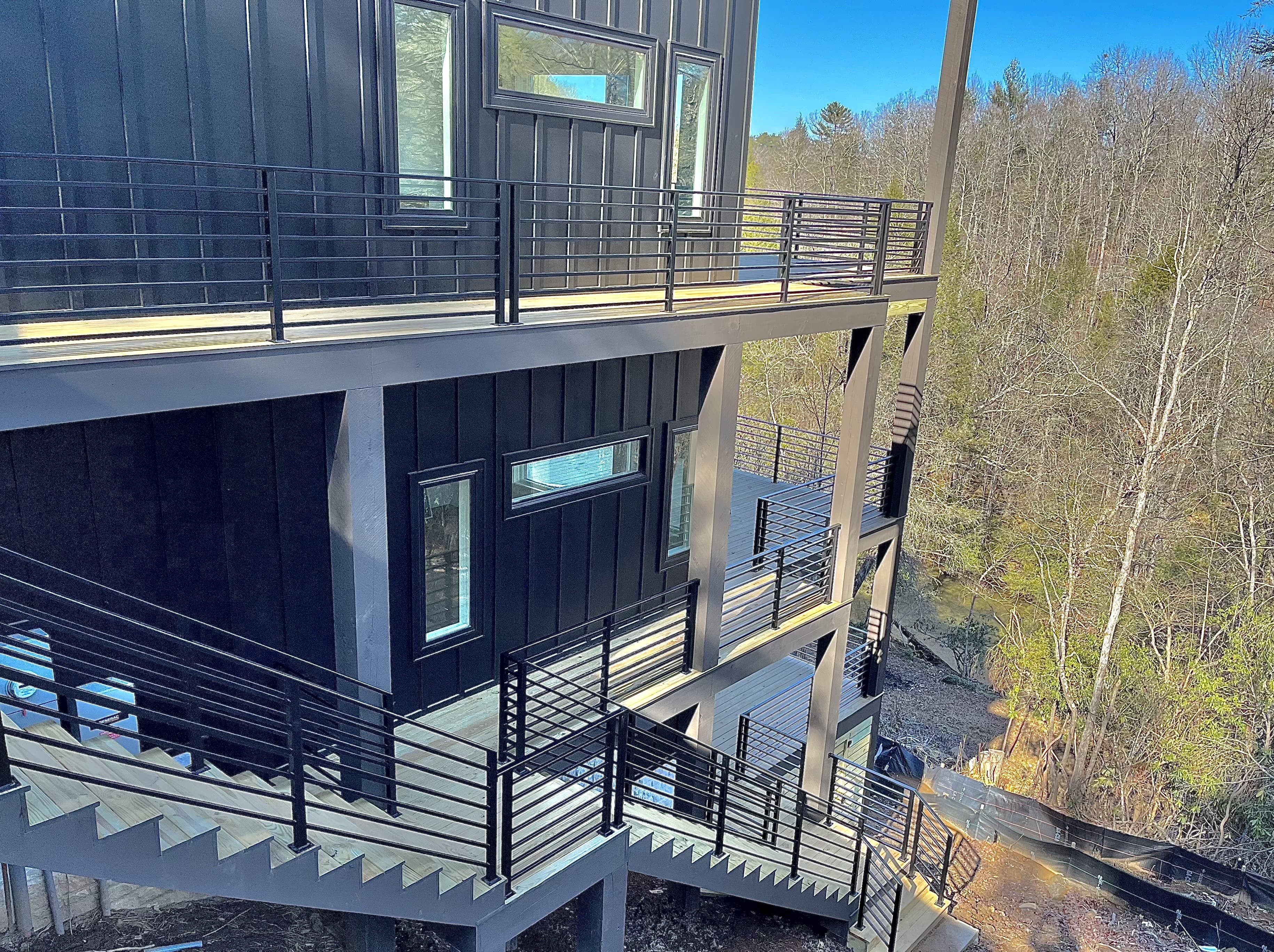 Wrought iron railing installation on a residential stair or deck.