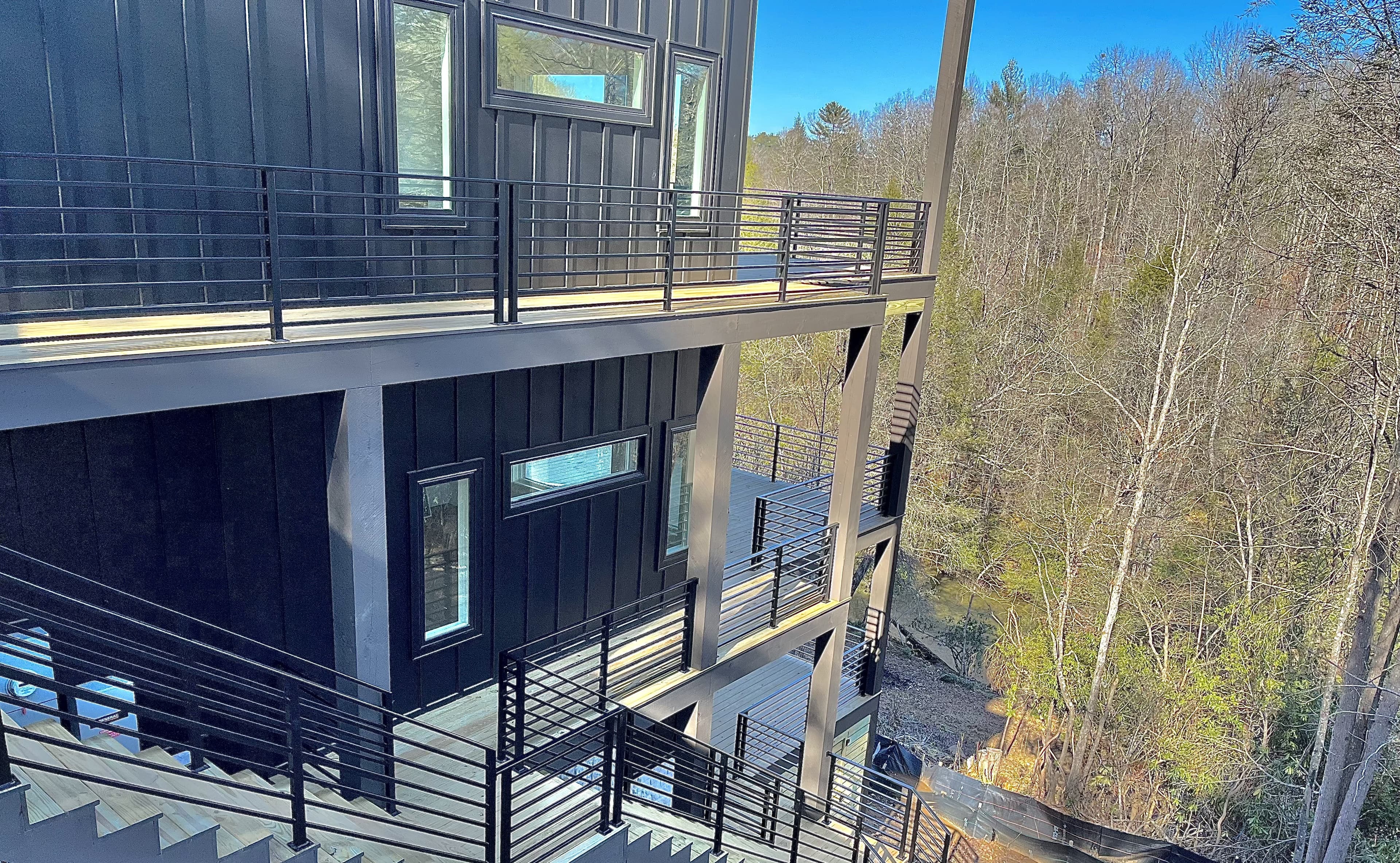 New construction home exteriors with glass packages.