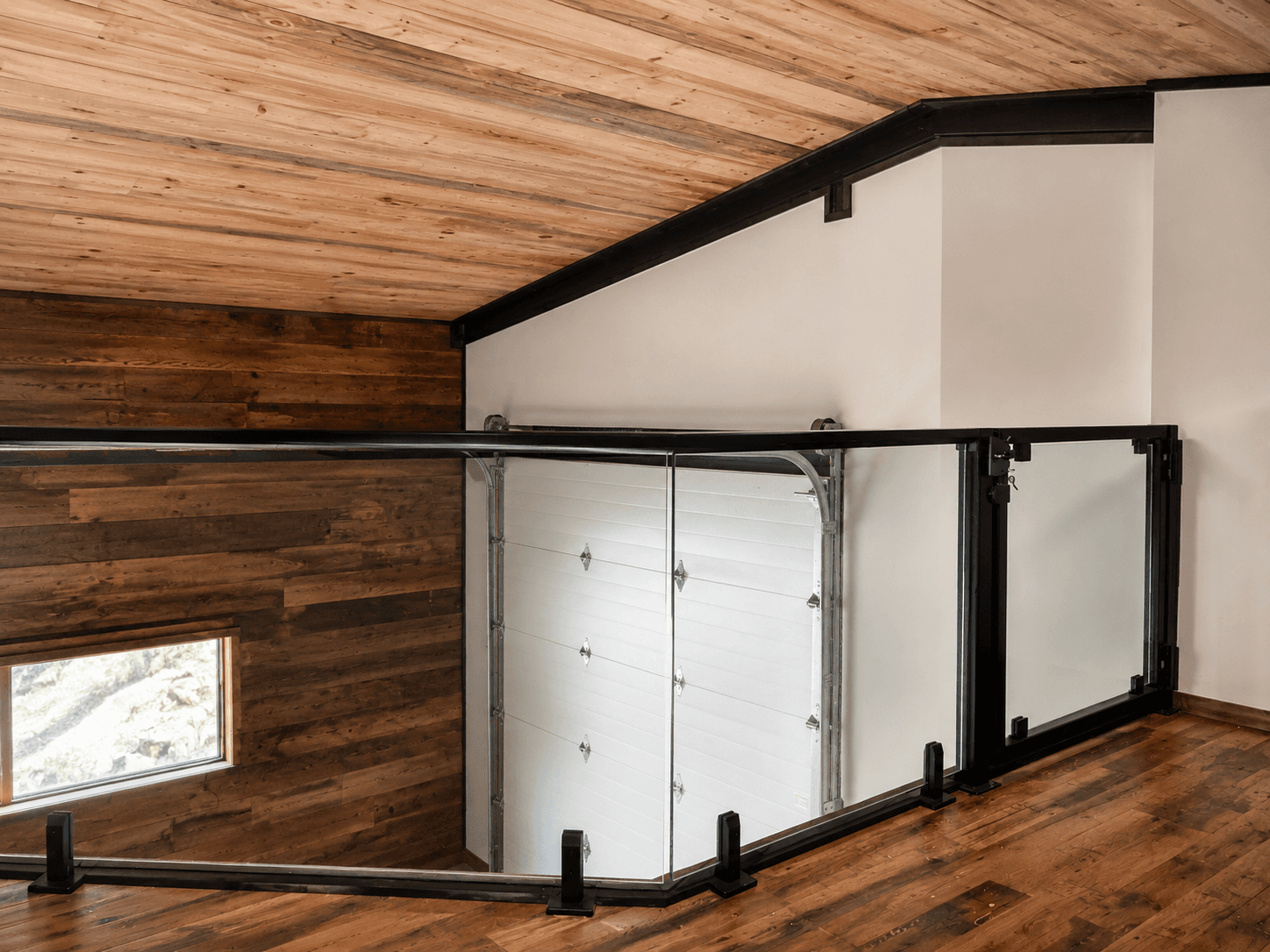 Interior glass railing measurement and installation on a stair run.