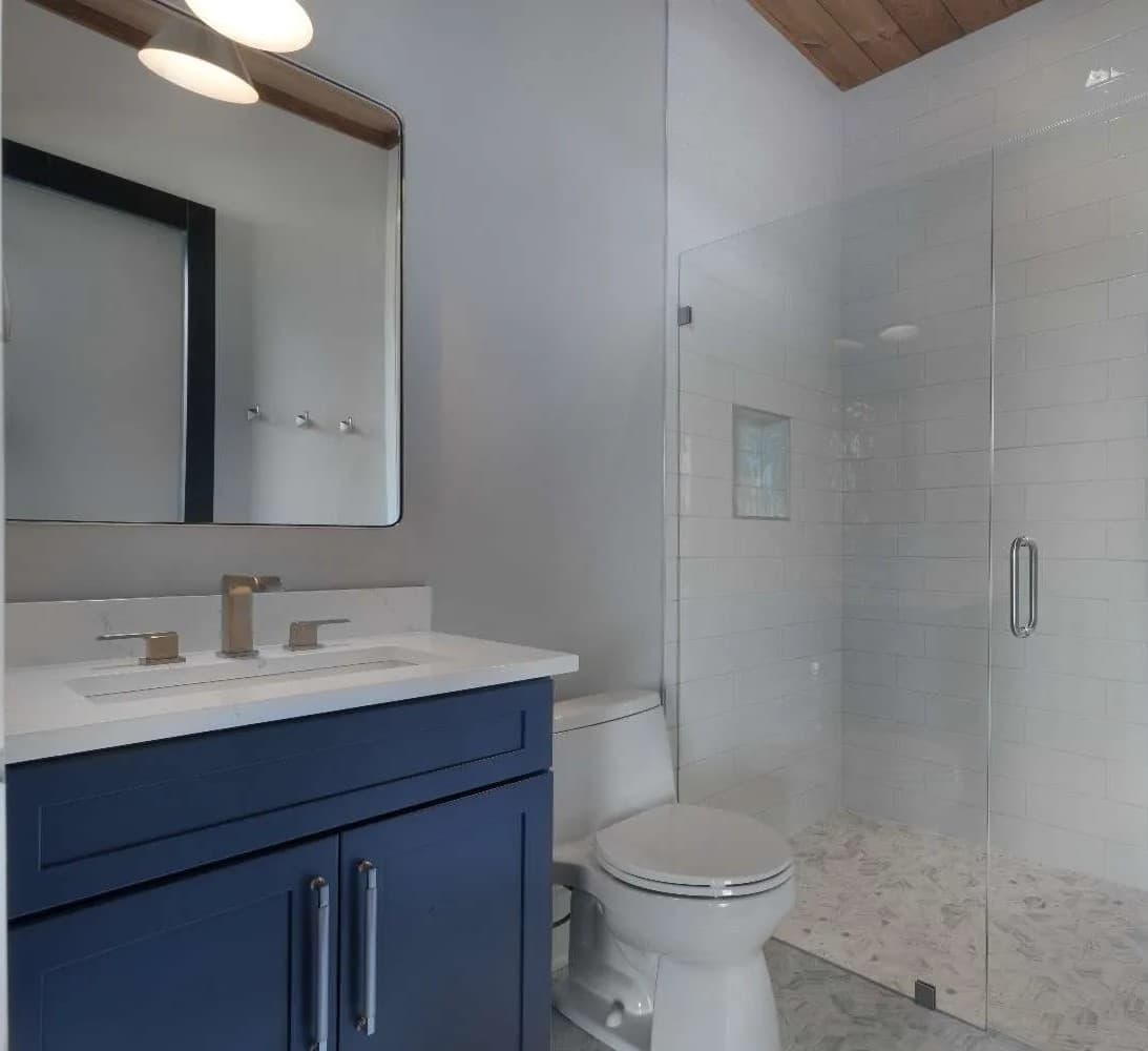 Custom mirror installation above a vanity.