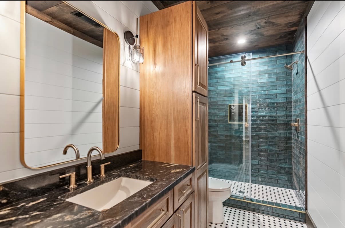 Sliding glass shower doors installed in a residential bathroom.
